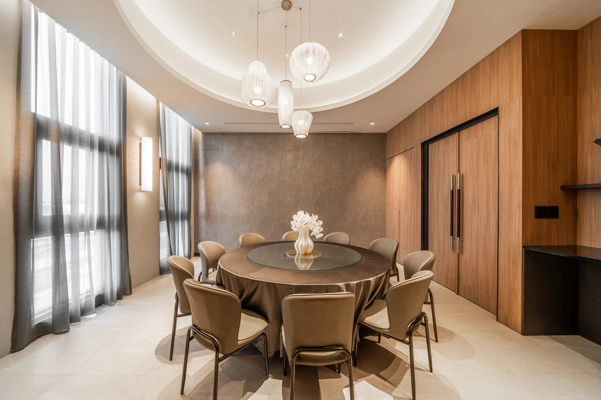 Dining room with pendant lights and timber wall panels