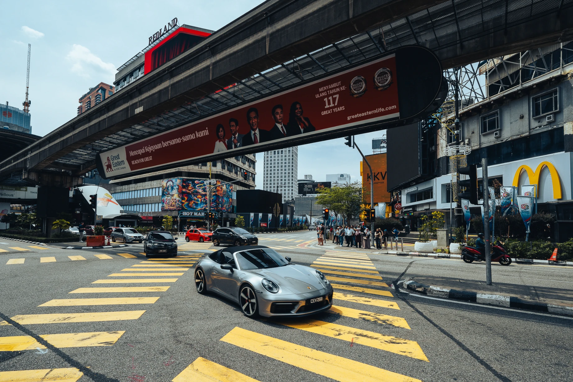 Contemporary architecture and everyday street life in Kuala Lumpur.