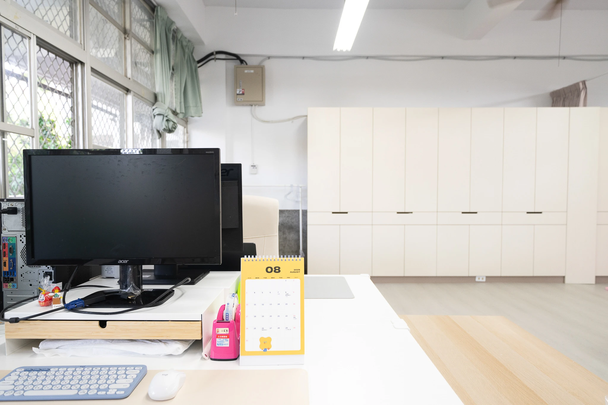 Teacher workstation beside the classroom storage area