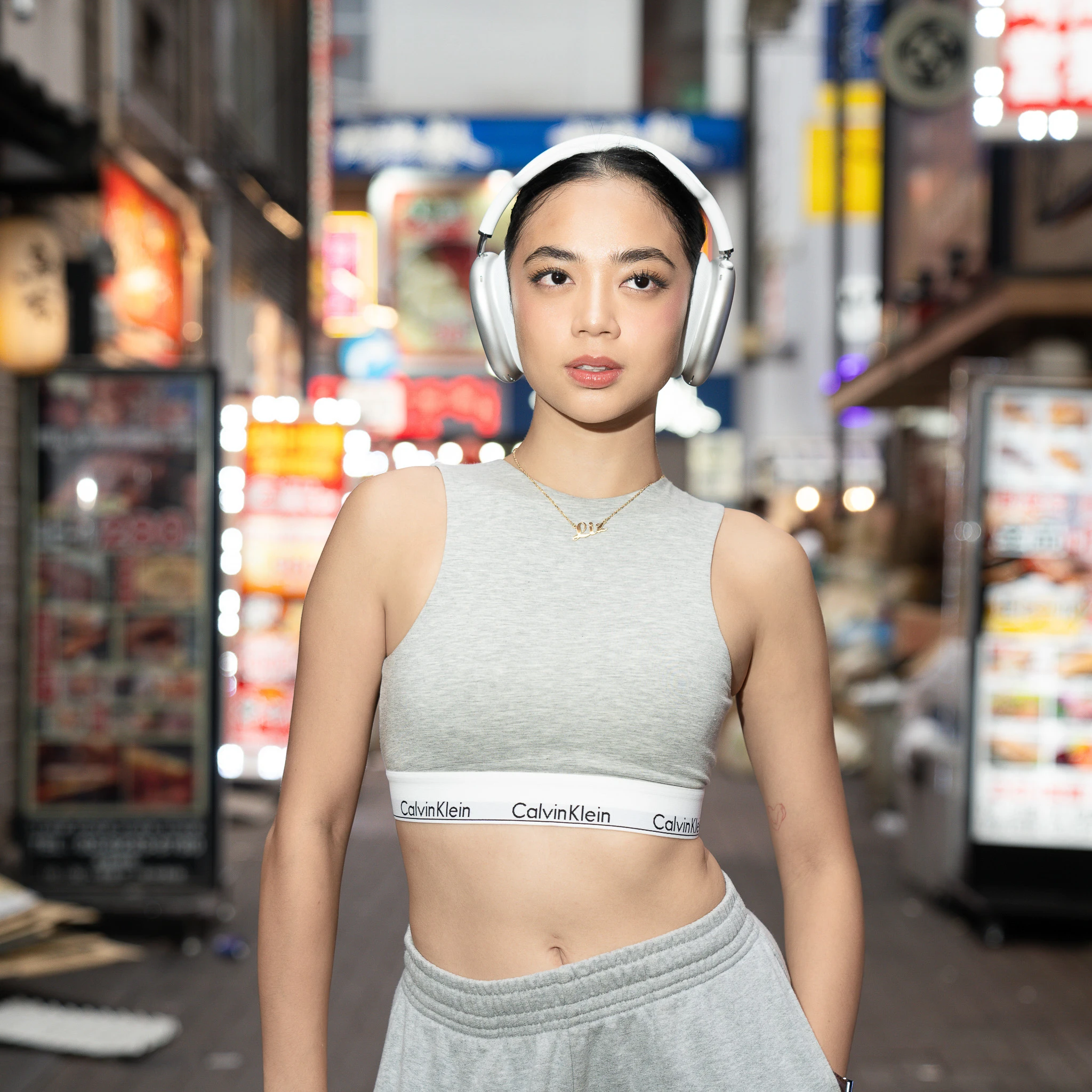 Fashion portrait on an illuminated Shinjuku street at night