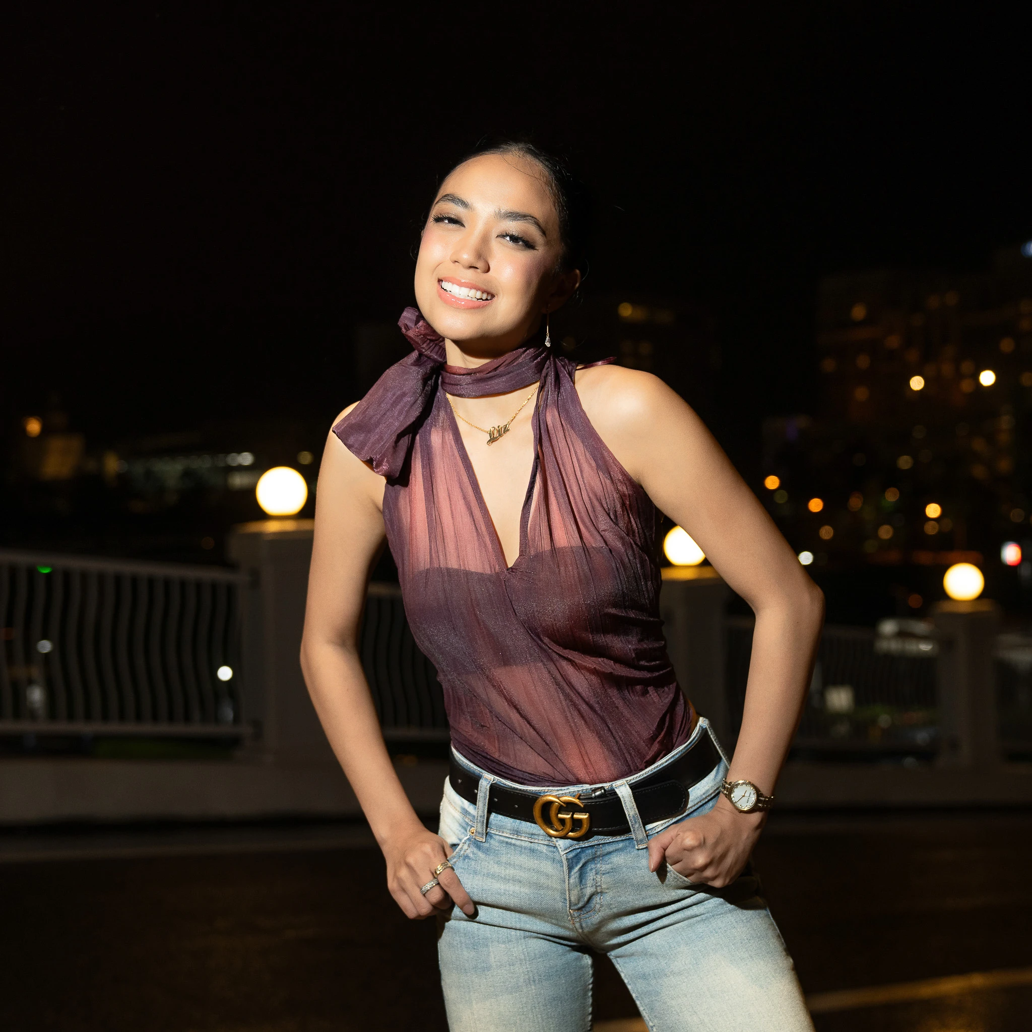 Smiling portrait with jeans and a burgundy halter top