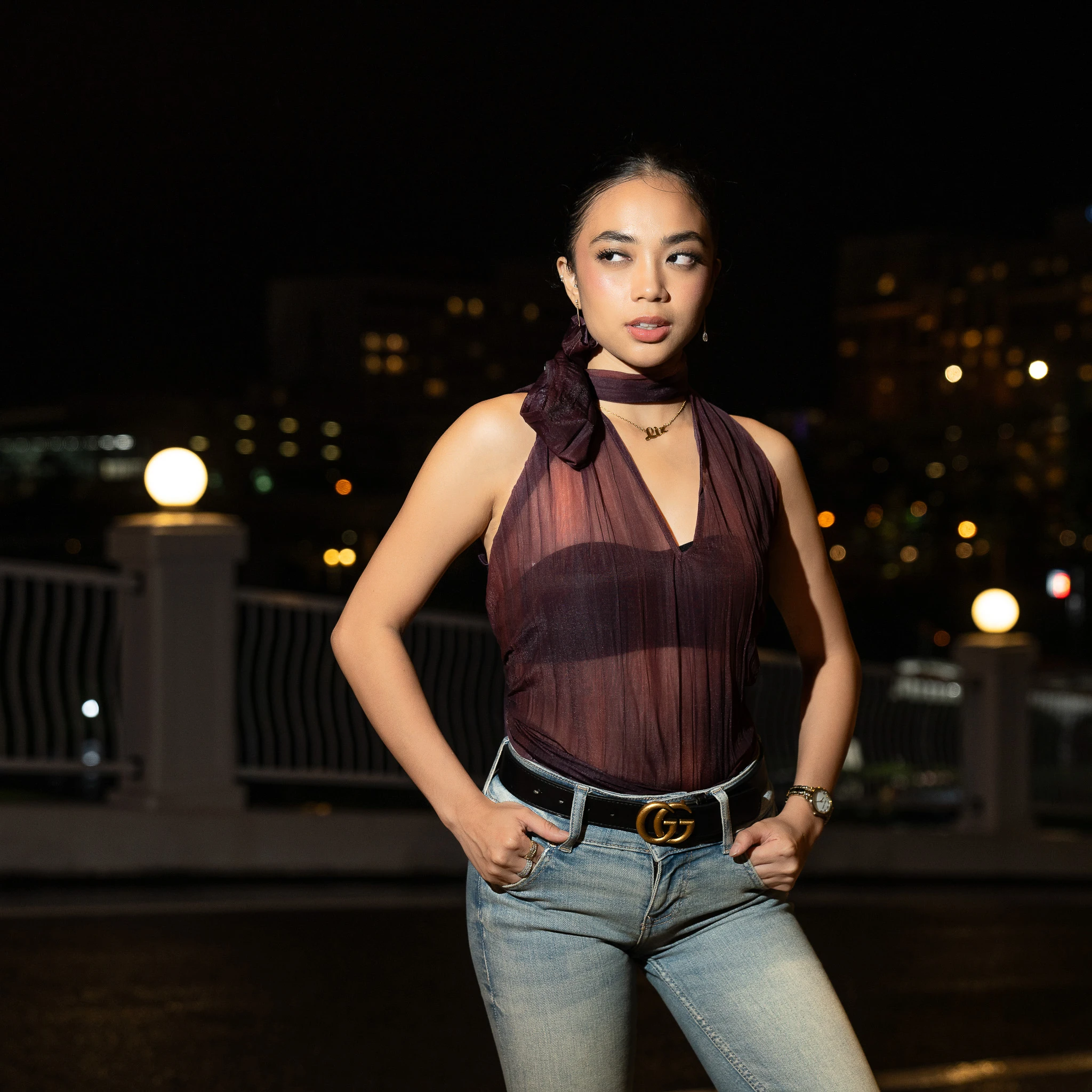 Standing night portrait with hands at the waist