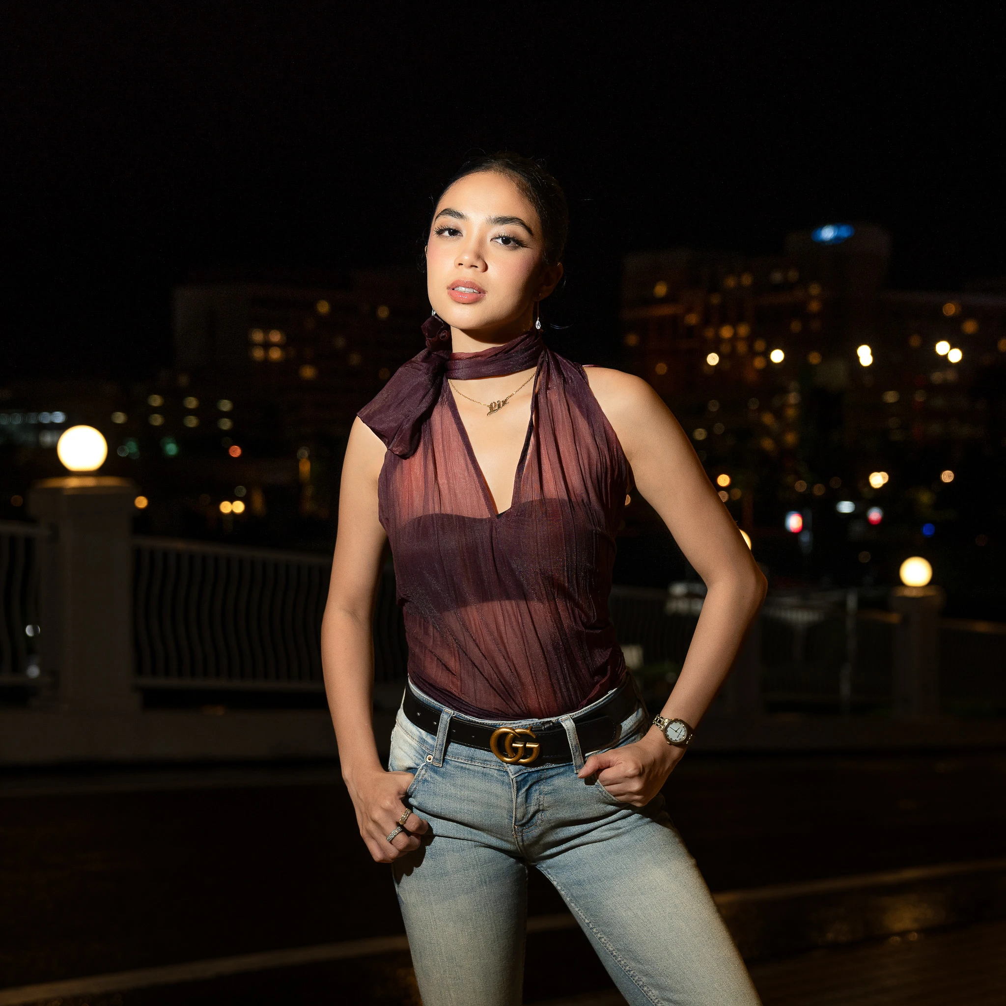 Three-quarter portrait with city lights in the background
