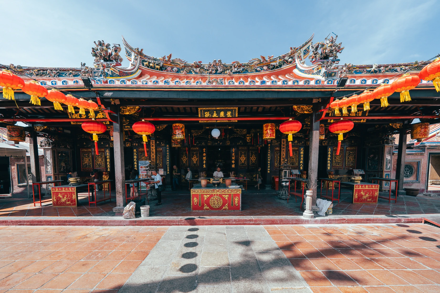 Sacred architecture and historic streets along Harmony Street in Melaka.