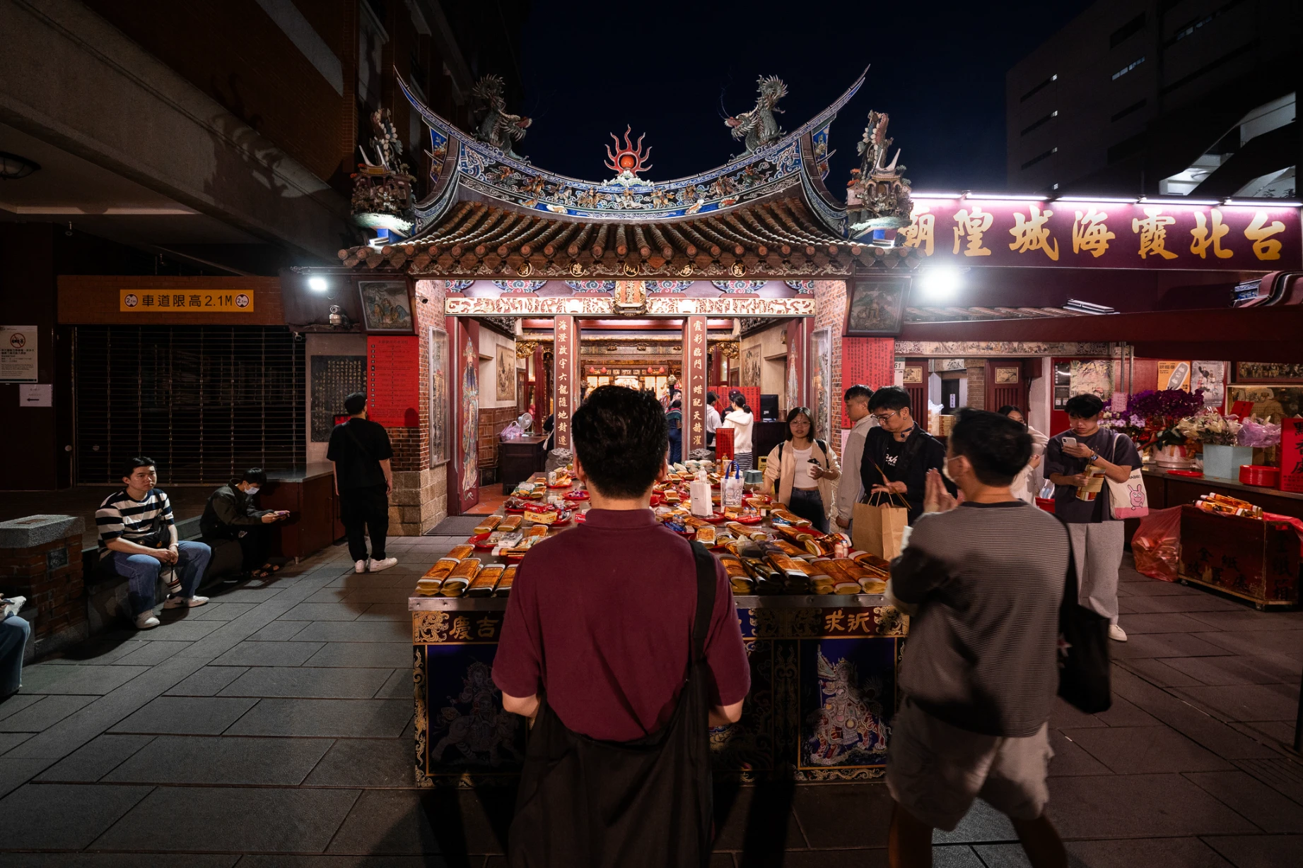 Historic shopfronts and everyday street life in Dadaocheng, Taipei.