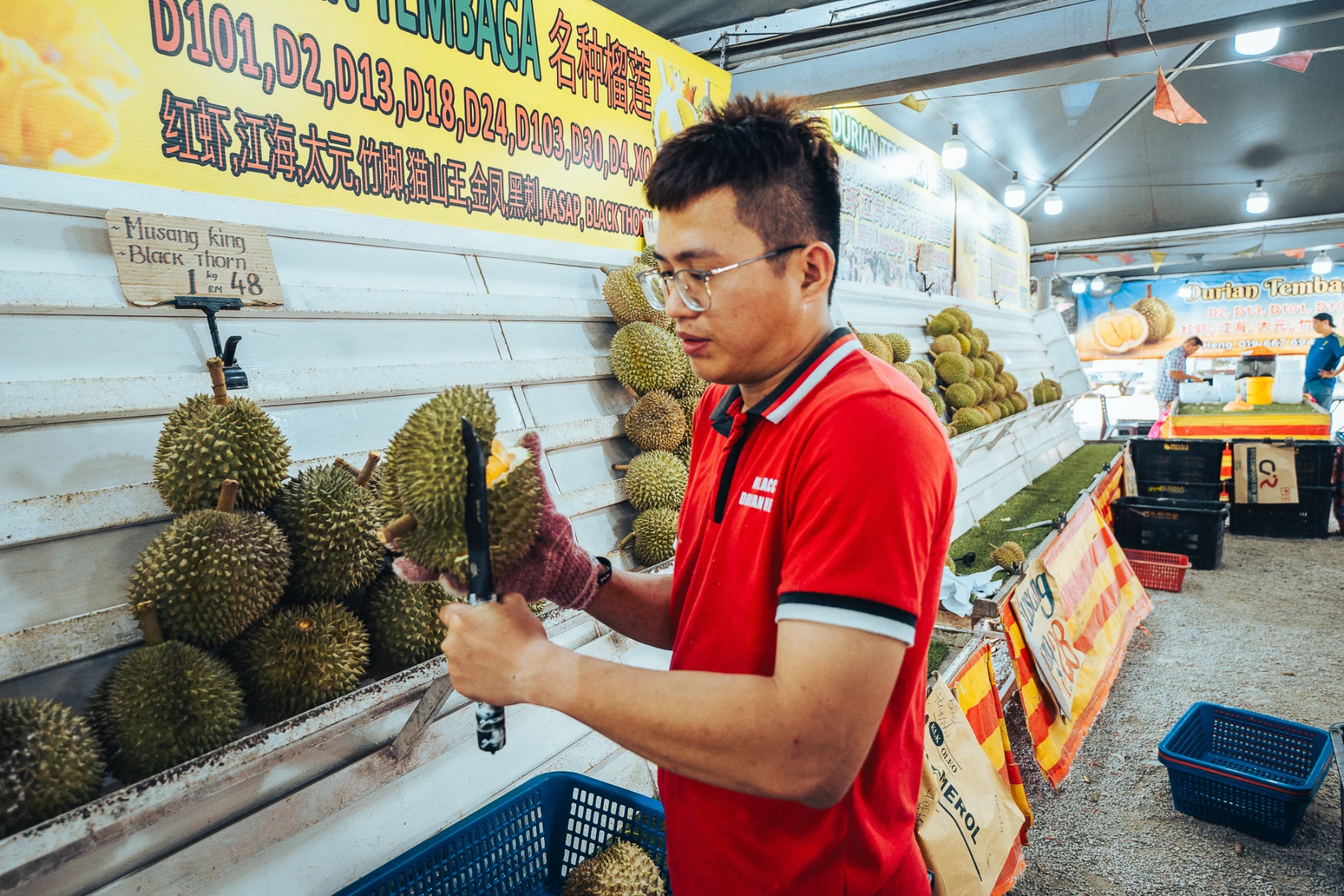 Fresh durian and local customers at Durian Heng in Melaka.
