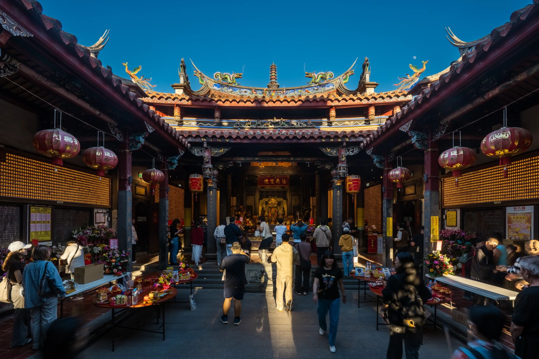 Historic temple architecture and devotional details at Lecheng Temple in Taichung.