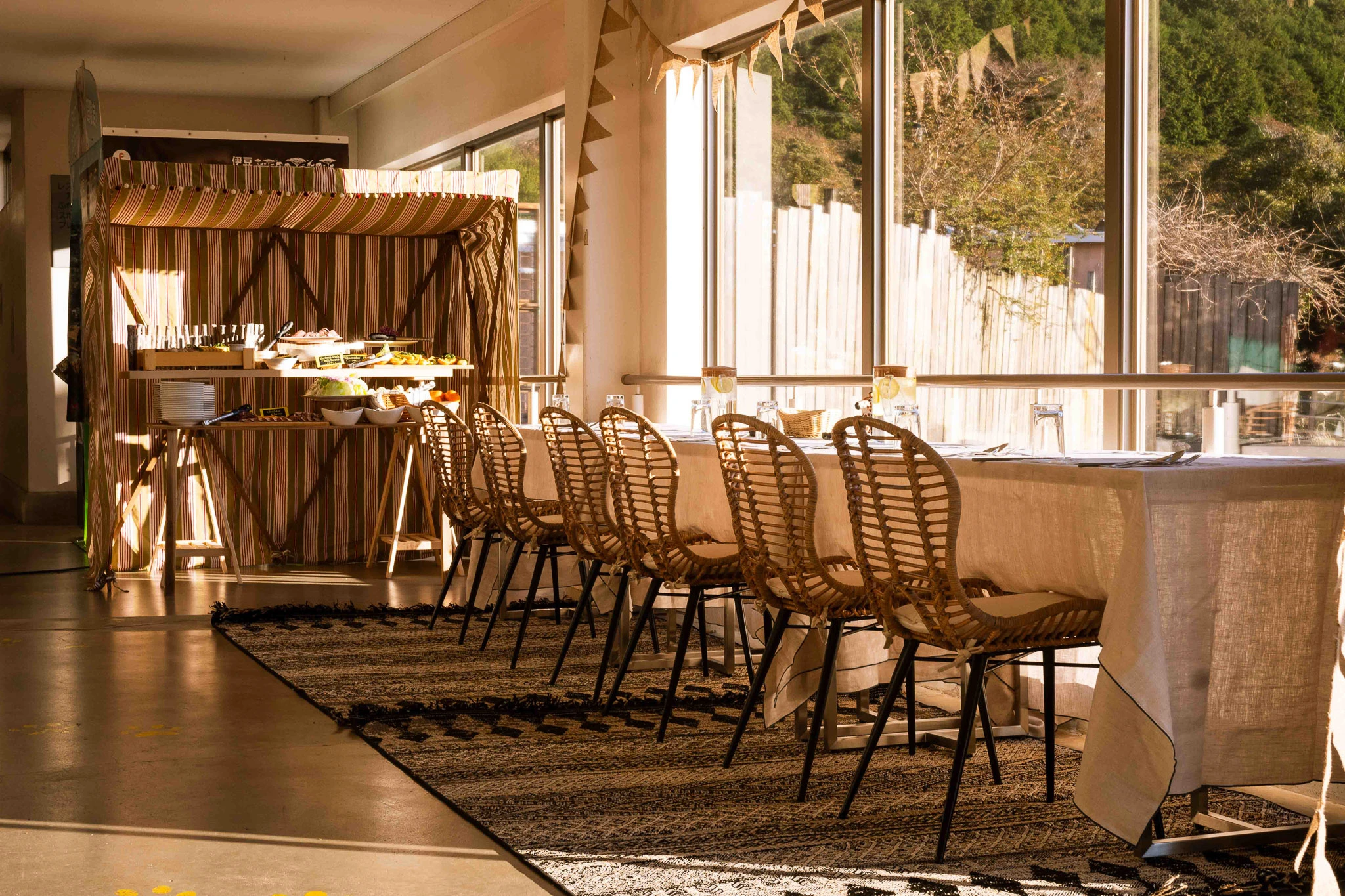 Empty chairs and tables in warm afternoon light