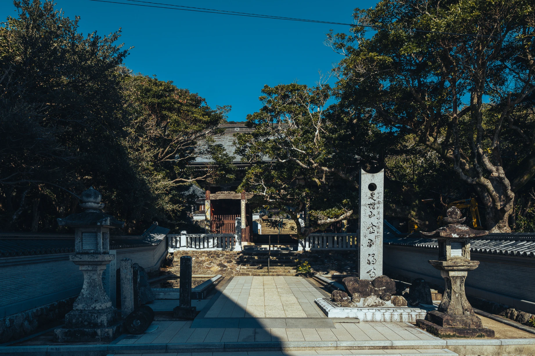 Sacred architecture and ritual details at Kongofukuji Temple in Shikoku.