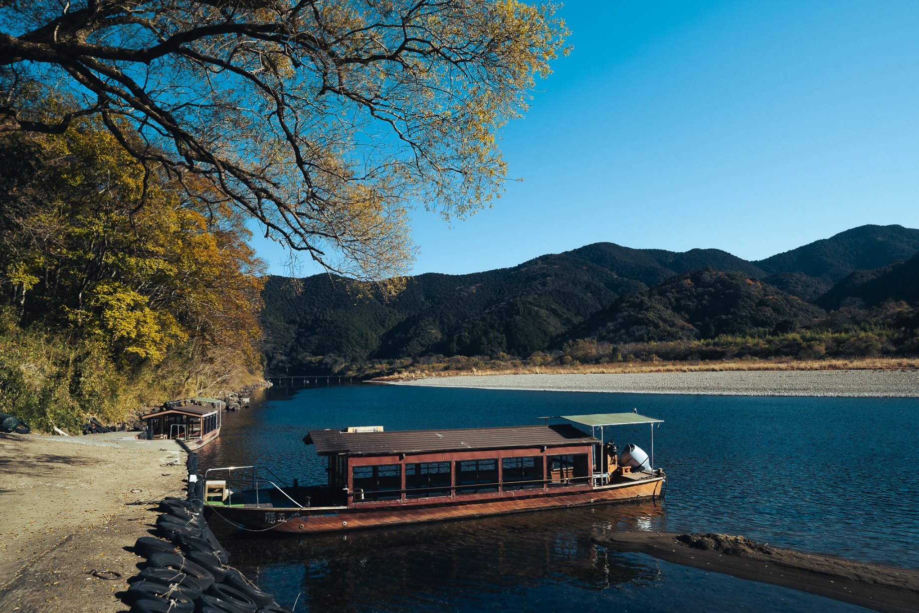 Boat journey through rural scenery along the Shimanto River in Shikoku.