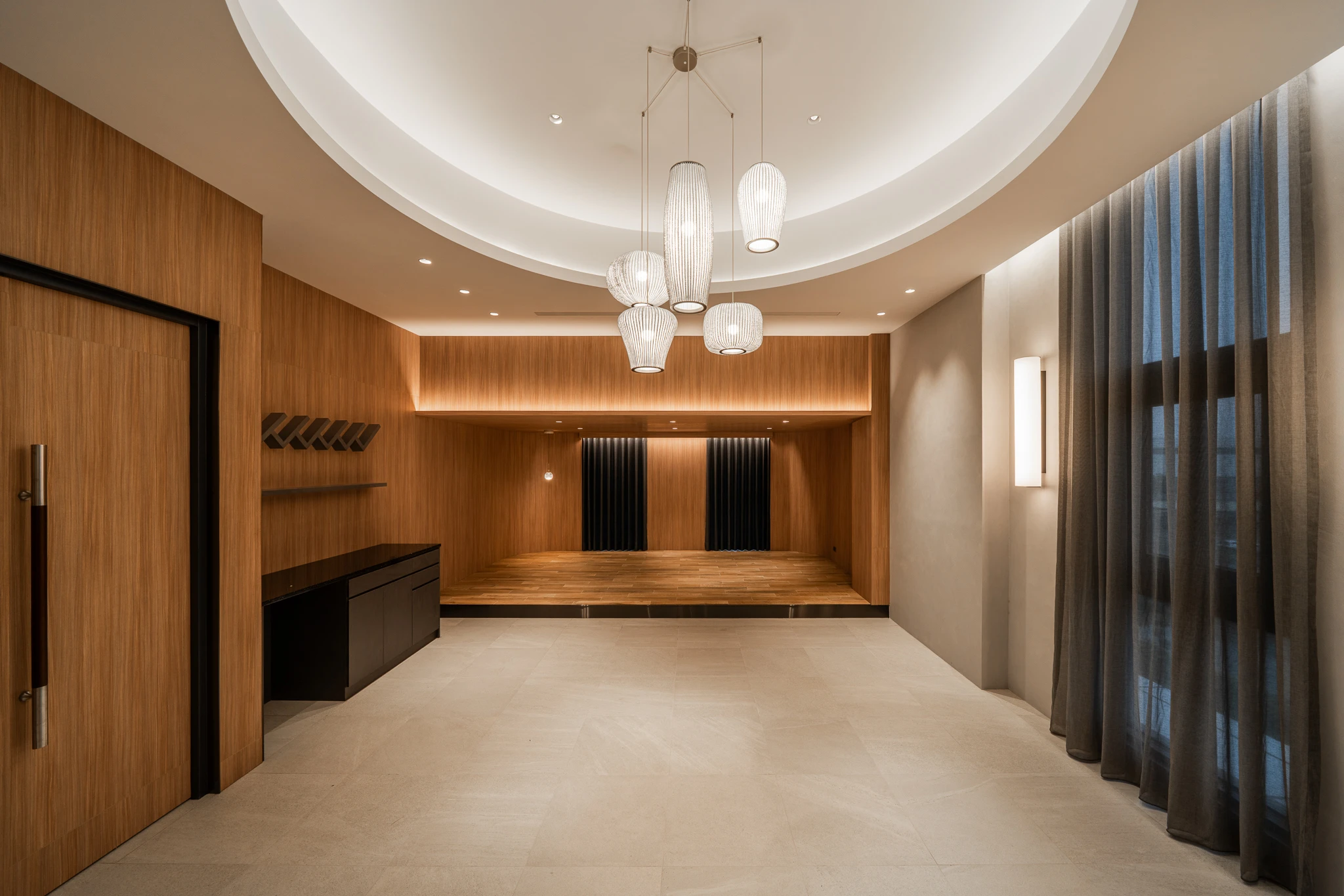 Timber-panelled reception room with circular ceiling detail