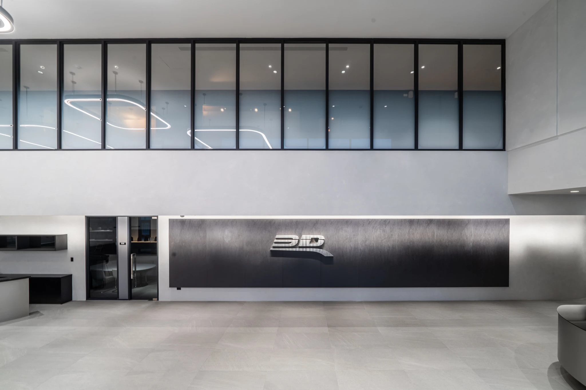 Factory reception viewed across the double-height hall