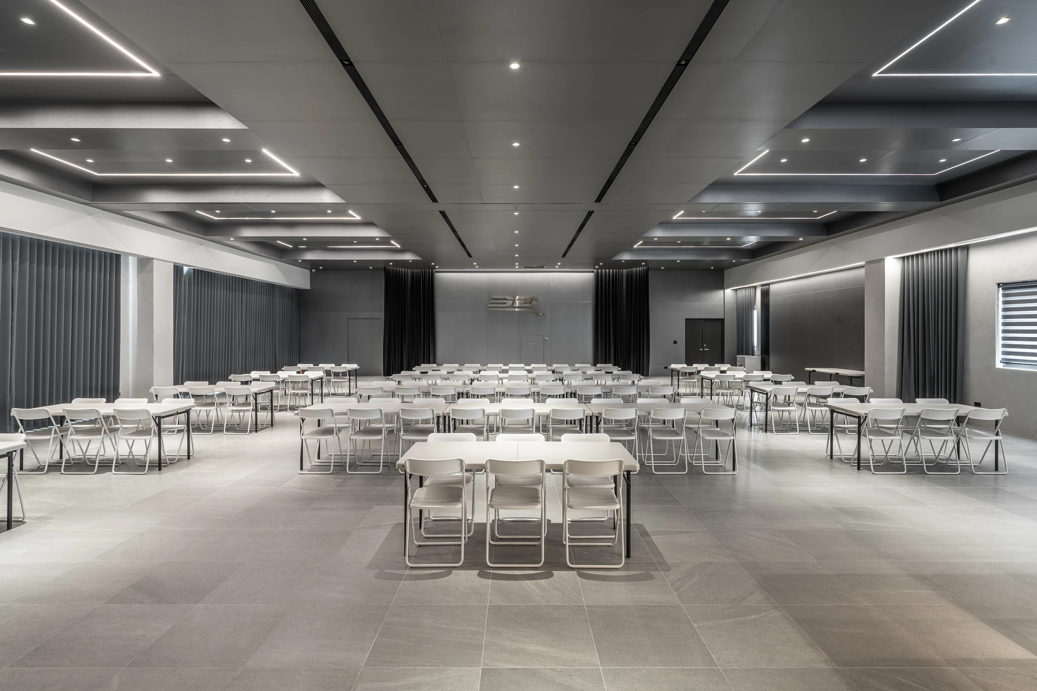 Rows of tables in a large meeting and training room