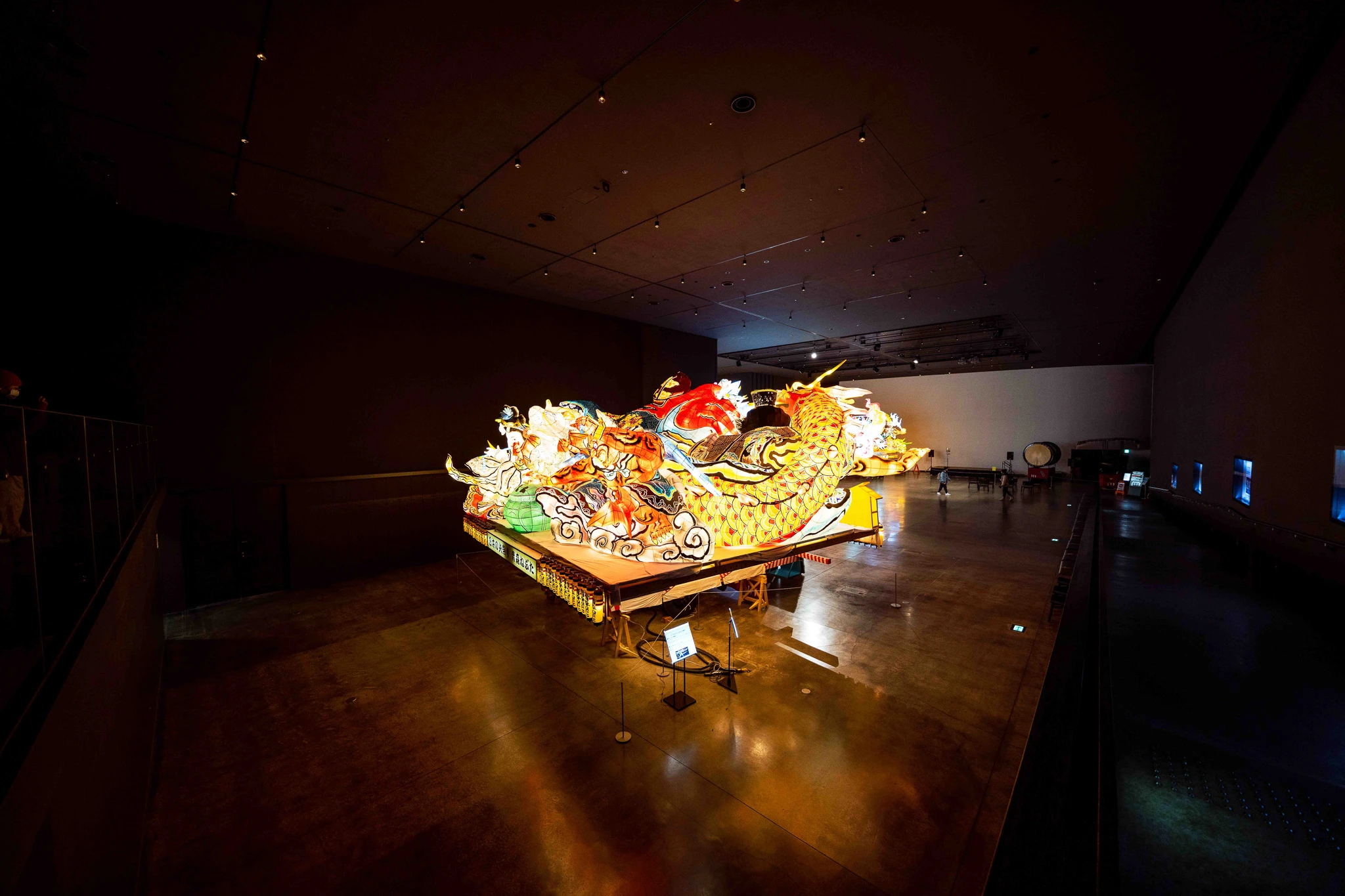 Glowing float and floor reflections in the exhibition hall