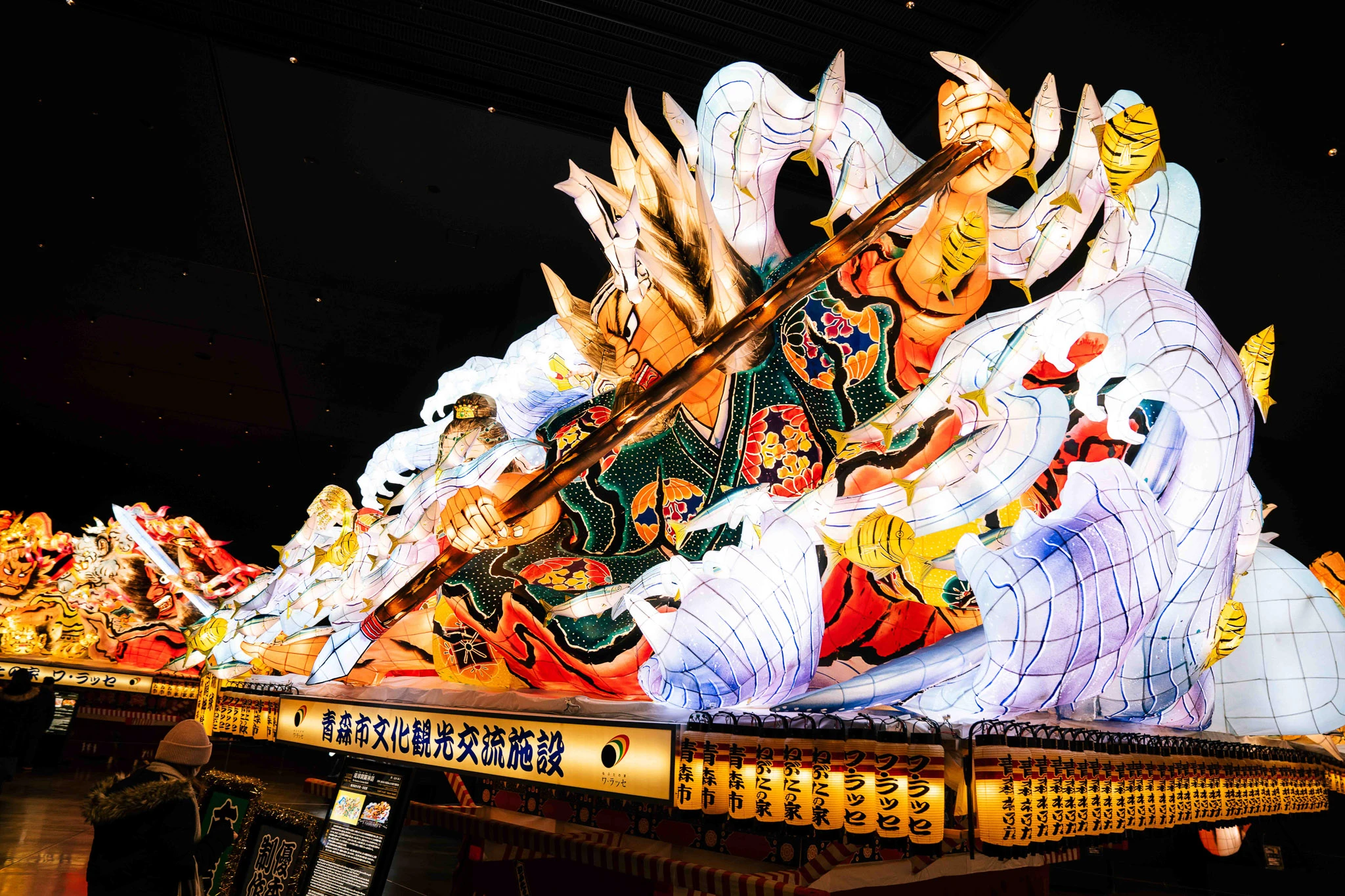 Illuminated Nebuta figure displayed inside WA RASSE