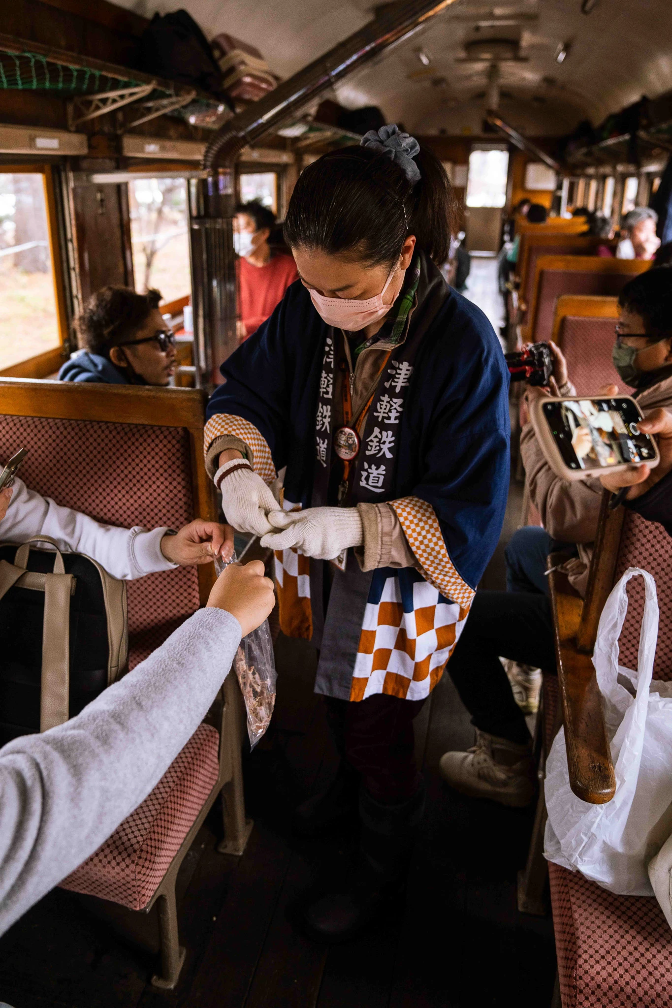 Staff member serving a passenger inside the carriage