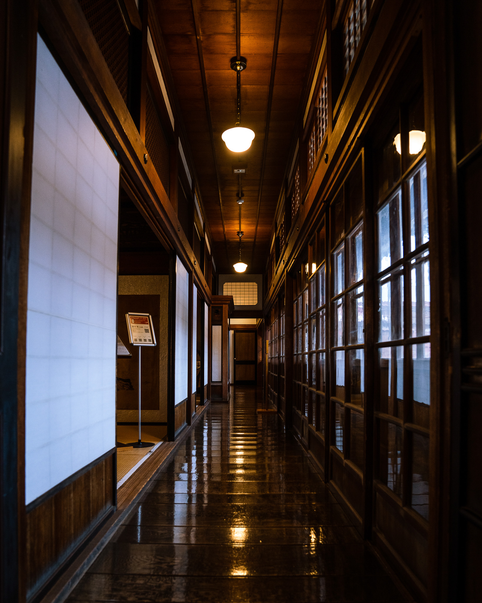 Reflections along a long timber corridor