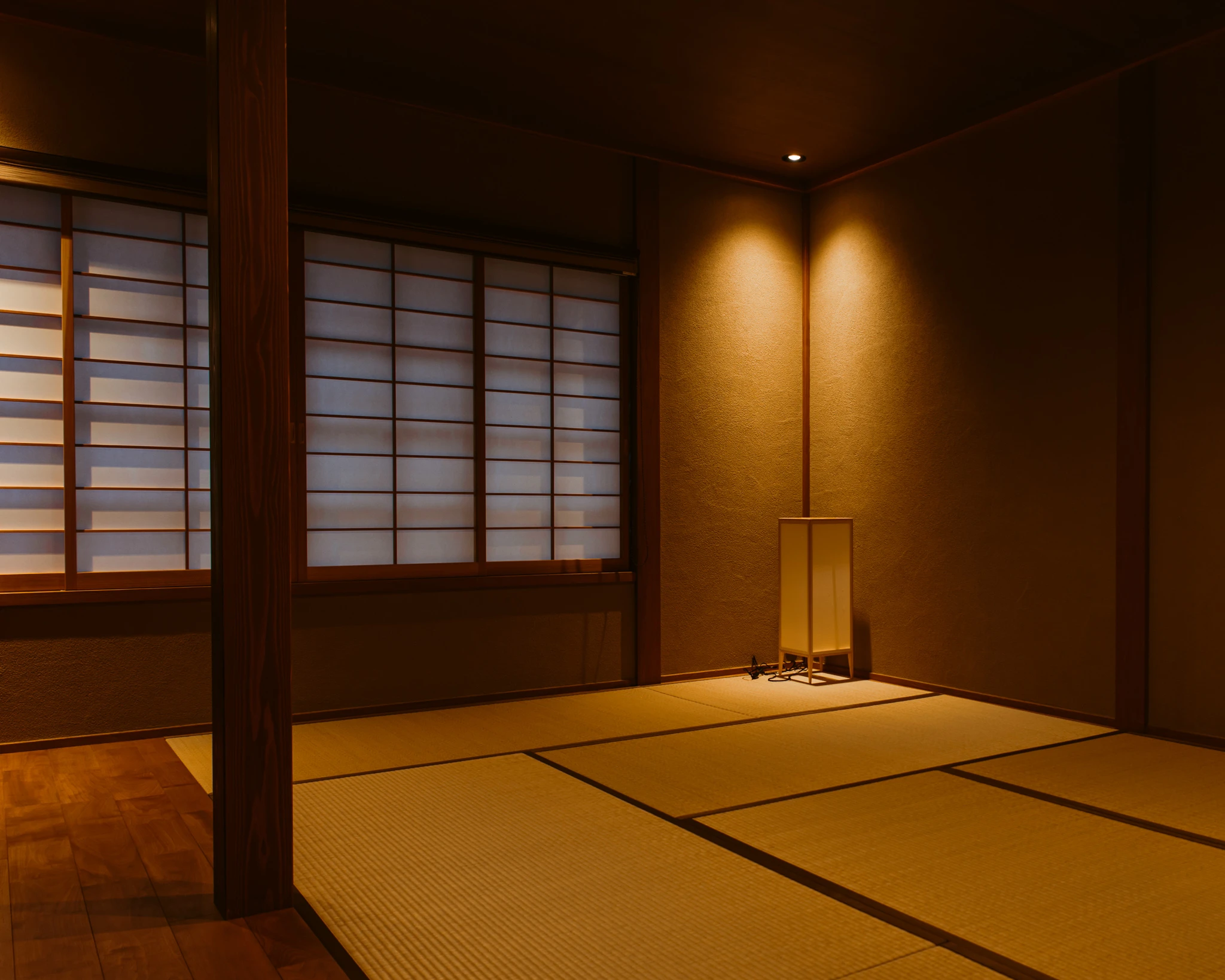 Tatami room with paper screens and warm wall lights