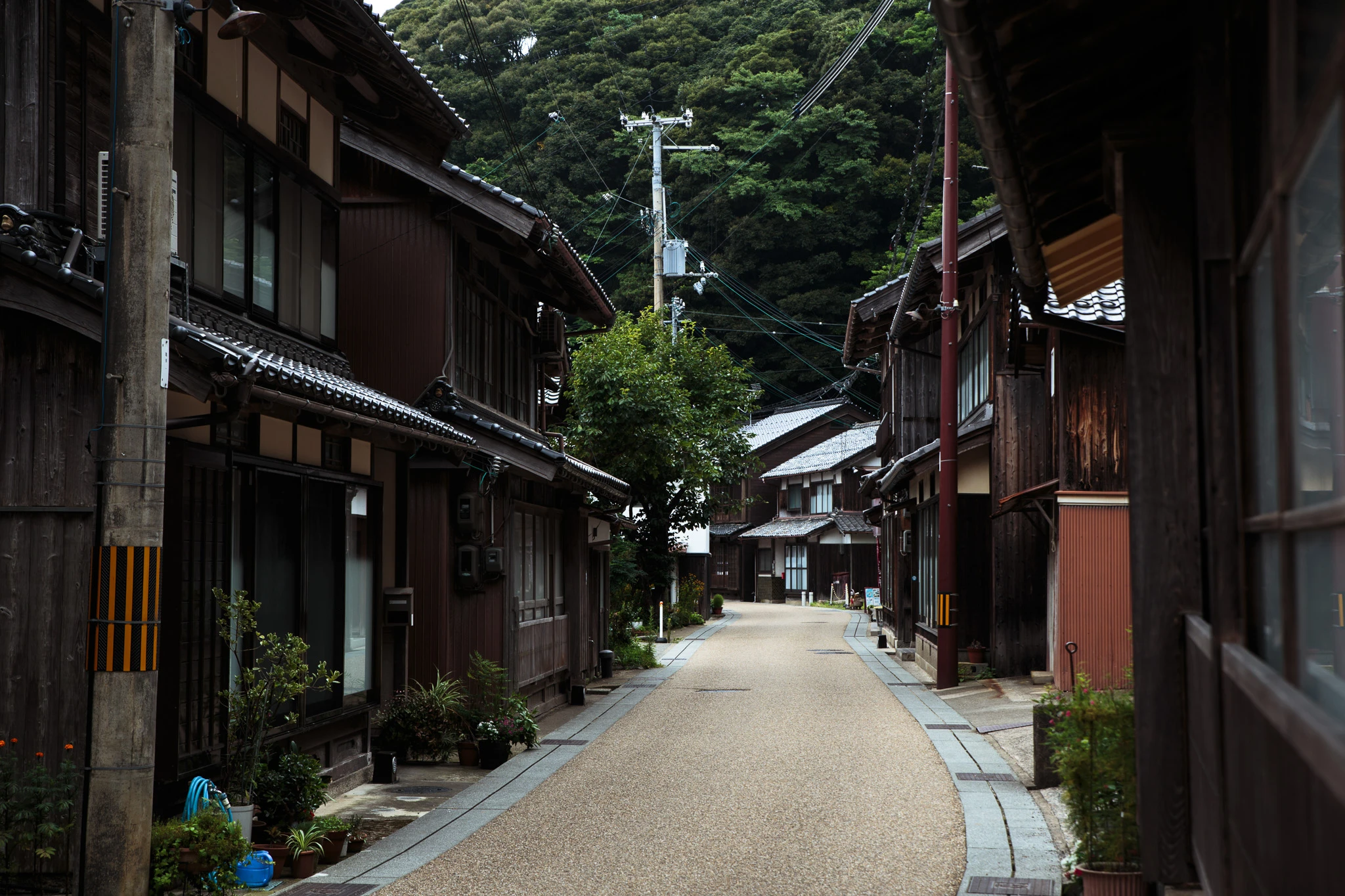 Narrow lane between timber buildings in Ine