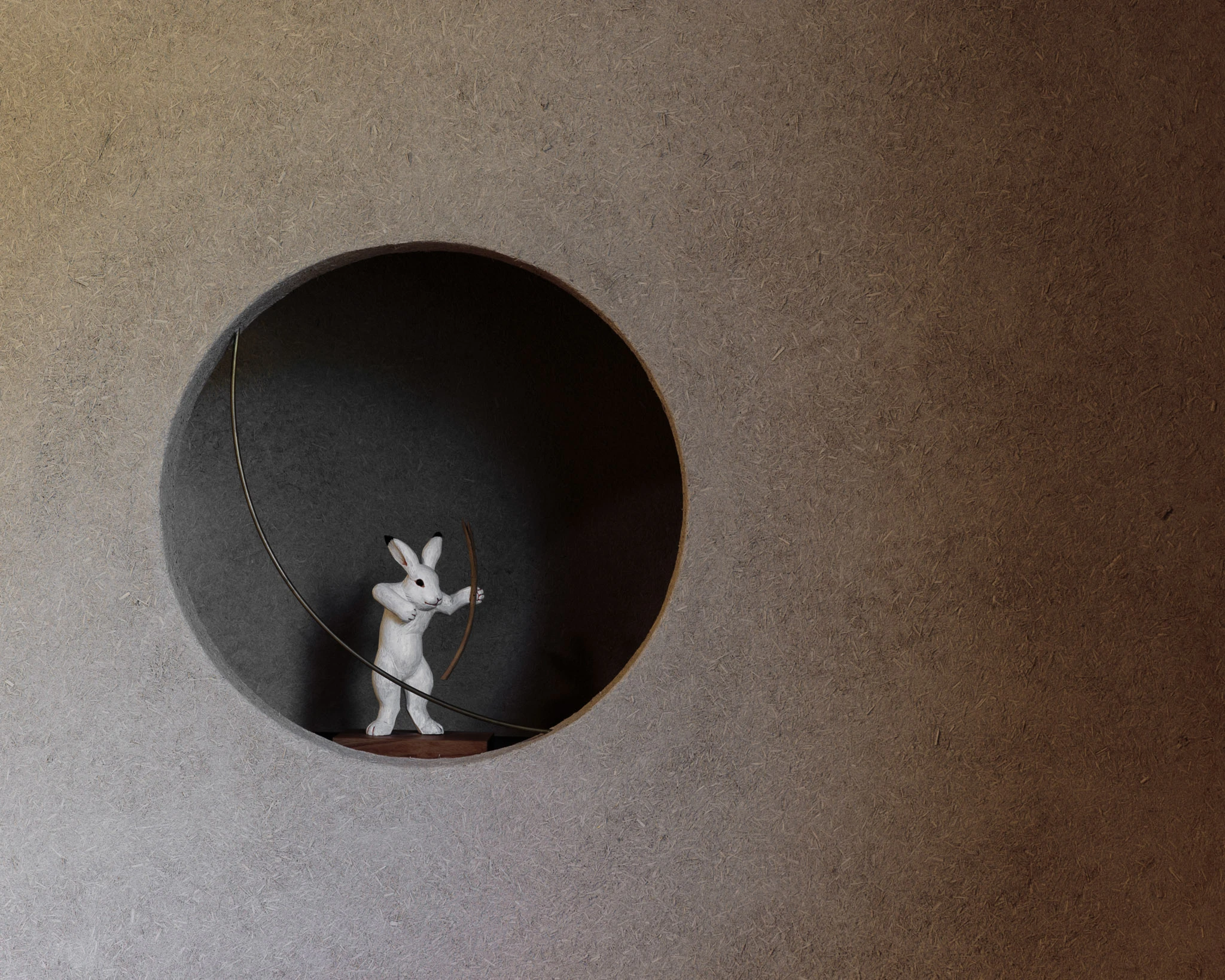 Small decorative figure in a circular wall niche