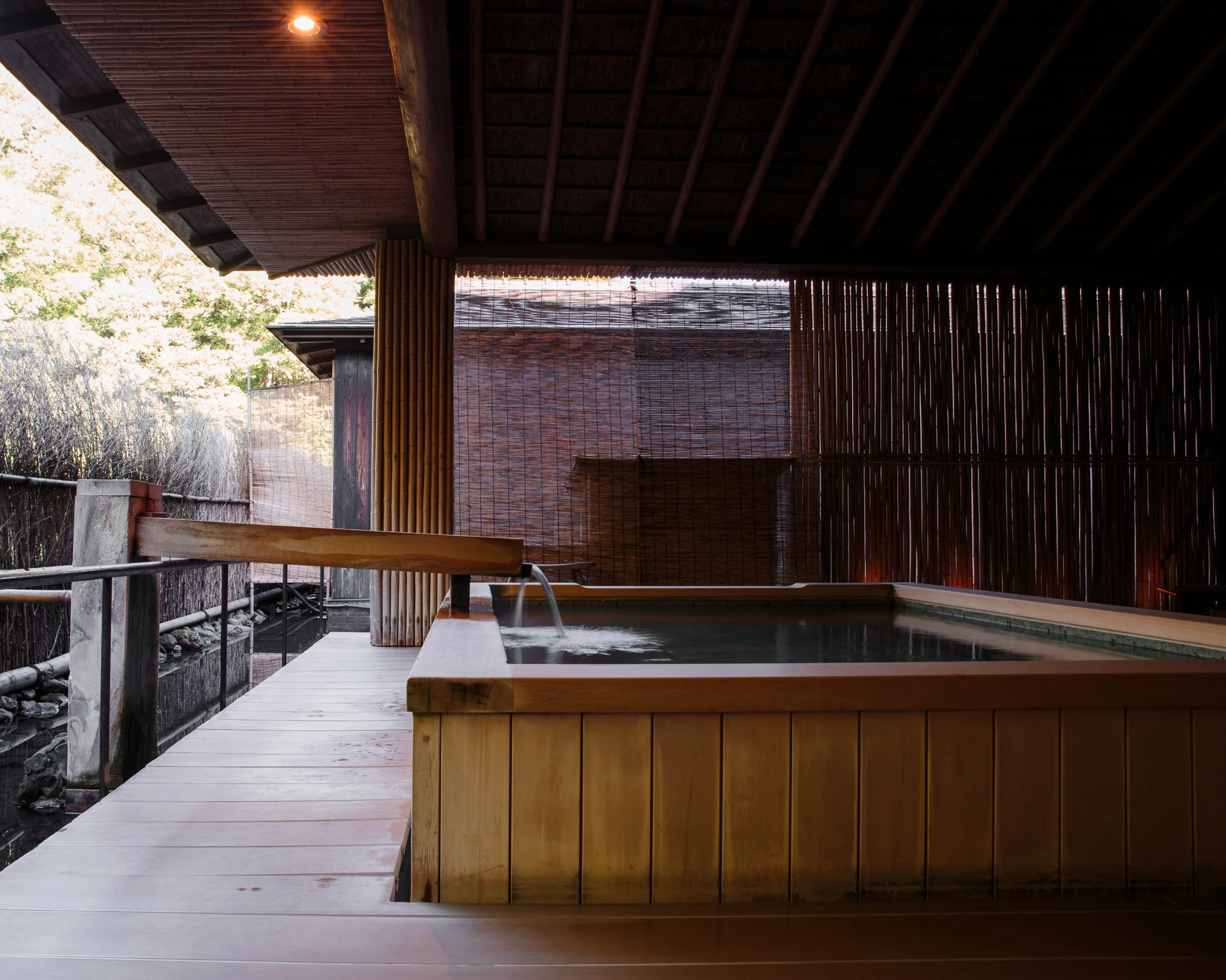 Open-air bath beside timber screens