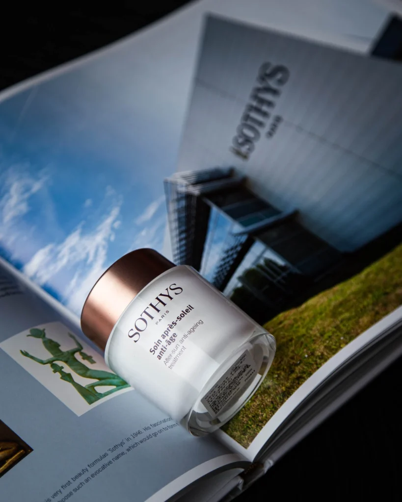 A white Sothys jar arranged on an open magazine.