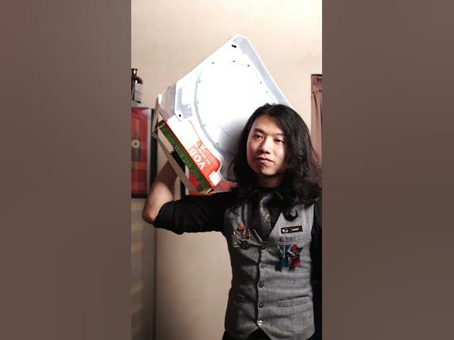 A Moonwell bartender carrying a box before the shift