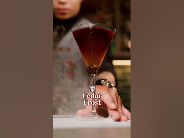 Moonwell Cedar Frost cocktail surrounded by mist