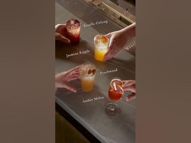 A tray holding a selection of colourful Moonwell cocktails