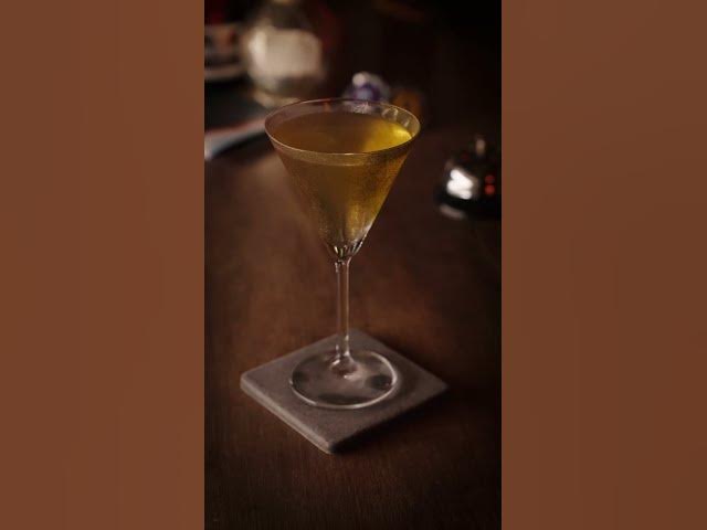 An amber cocktail in a stemmed glass on the Moonwell bar